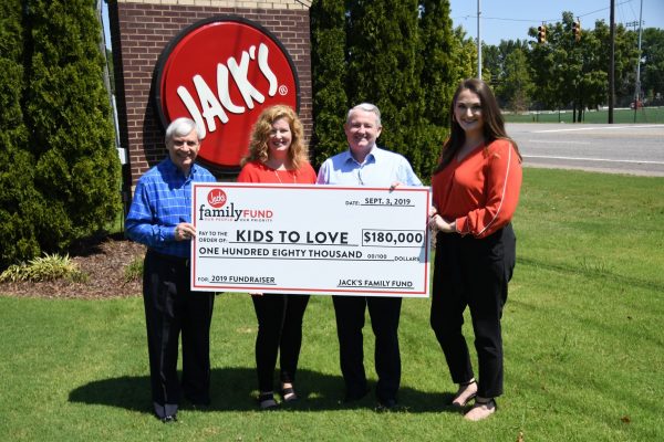 JFF presents check to Kids to Love